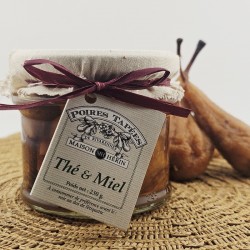 Bocal de 3 poires tapées au thé et miel Maison Hérin, couvert d'un tissu.